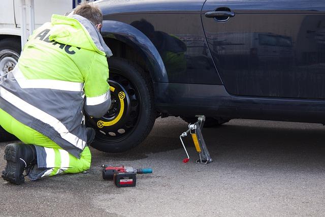 Image of a Man Changing a Flat Tyre